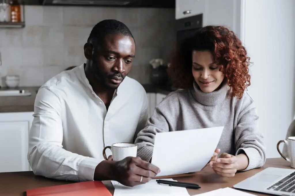 Mortgage renewal Ontario - couple reviewing renewal paperwork