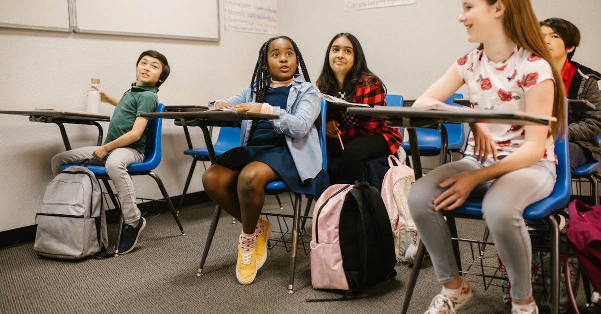 A diverse group of students attentively participating in a classroom setting.